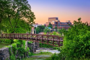 View of the Columbus, GA city behind a bridge.